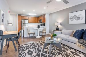 a living room with a couch and a table at Landing Bellingham Park - Wilmington in Wilmington