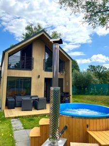 a house with a swimming pool in the yard at Brzozowa Osada in Zagórze Śląskie
