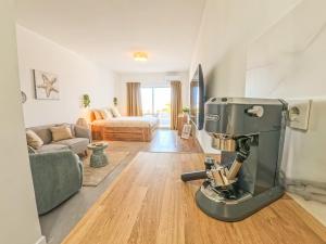 a kitchen with a mixer in the middle of a living room at Jandia Sunrise, Your Sweet Holiday Home in Morro del Jable