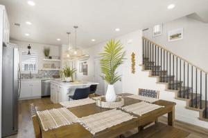 a kitchen and dining room with a table and a dining room at Happy Hawaiian Themed Condo in Washington +41 photos