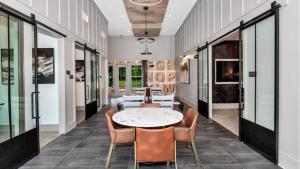 a dining room with a table and chairs at Landing Apartments Dry Creek - Huntsville in Huntsville