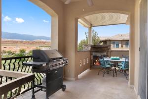 an outdoor patio with a grill and a table with a table at The View - Resort Amenities & Epic Views in Washington
