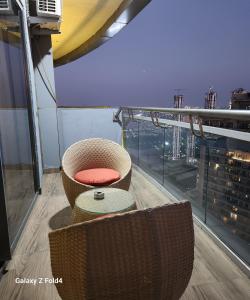a room with a chair and a window at Euphoria 42nd floor by Rouge stays in New Delhi