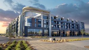a large building with a lot of windows at Landing at Emory at RED - Reno in Reno