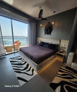 a bedroom with a bed with a view of the ocean at Euphoria 42nd floor by Rouge stays in New Delhi