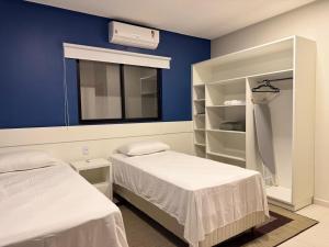 a hospital room with two beds and a window at Flats Tavares Araujo apt 102 in Garanhuns