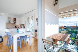 a kitchen and dining room with a table and chairs at A Casa Di Dona in Rimini