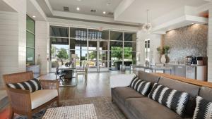 a living room with a couch and a table at Landing at The Green at Plum Creek - Kyle in Kyle