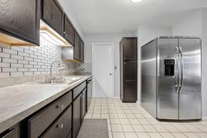 a kitchen with a stainless steel refrigerator at Casa Playa - Private Home for 6 in St. Augustine
