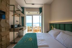 Postel nebo postele na pokoji v ubytování Hotel Royal