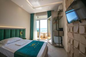 Postel nebo postele na pokoji v ubytování Hotel Royal