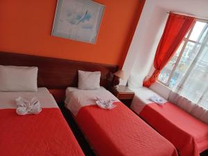 Hotel Bogota客房内的一张或多张床位