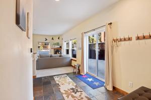 a living room with a couch and a window at Sunny Woods Acres - Near Golf & Adventure Park in Tahoe Vista