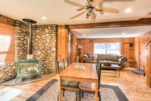 a living room with a fireplace and a table at Moonlight Cove w Grill Tahoe Beach Next Door in Tahoe Vista