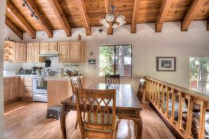 a kitchen with a table and chairs in a room at Glacier Forest Getaway HOA Access in Truckee