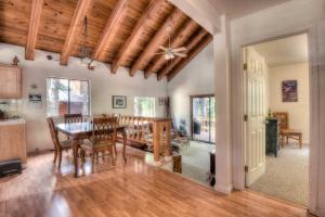 a kitchen and dining room with a table and chairs at Glacier Forest Getaway HOA Access in Truckee