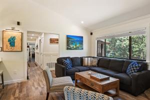 a living room with a couch and a table at Incline Bliss Dreamy Pet Friendly Escape in Incline Village
