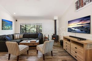 a living room with a couch and a fireplace at Incline Bliss Dreamy Pet Friendly Escape in Incline Village
