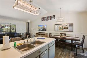 a kitchen with a sink and a living room at Incline Bliss Dreamy Pet Friendly Escape in Incline Village +27 photos