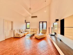a large living room with couches and a flat screen tv at Kumbor sunny port with shared pool in Kumbor