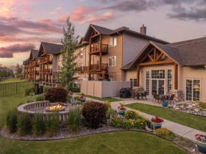 a home with a fire pit in the yard at Best Western Plus Riverfront Hotel and Suites in Great Falls