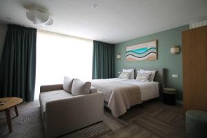 Ένα ή περισσότερα κρεβάτια σε δωμάτιο στο Best Western Beach Hotel Bergen aan Zee +139 φωτογραφίες