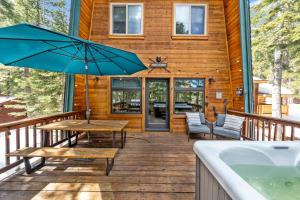 a wooden deck with a table and a tub at Tahoe City Retreat - For 8 in Tahoe City +60 photos