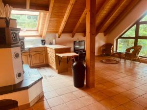 a kitchen with a stove and a sink in a room at Ferienwohnung Kern in Goldkronach