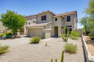 a house with a driveway and a garage at Spacious Family Oasis in Cave Creek! in Cave Creek