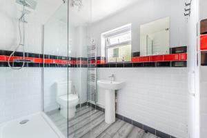 a white bathroom with a sink and a toilet at Modern 3 bed House in Upton +7 photos