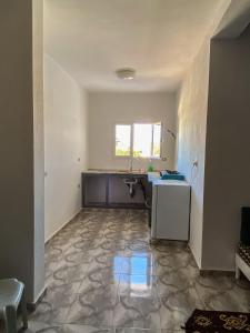 an empty kitchen with a sink and a counter at MG Zarzis 4 in Zarzis
