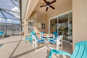 a dining room with a table and chairs on a balcony at Sunset Dreams Villa, Beautiful 4 Bedroom Villa with Private Pool Near Disney 422 in Orlando