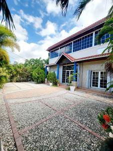 an office building with a gravel driveway in front of it at Kingston Manor Vacation Homes in Kingston