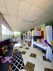 a large room with many beds in it with windows at Kingston Manor Vacation Homes in Kingston
