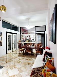 a living room with a table and a dining room at Kingston Manor Vacation Homes in Kingston