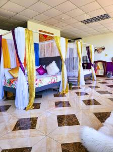 a room with two beds with curtains and a tiled floor at Kingston Manor Vacation Homes in Kingston +85 photos