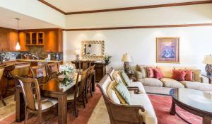 a living room with a couch and a table at Kolea 14F - Heated Pool Gym & More in Waikoloa