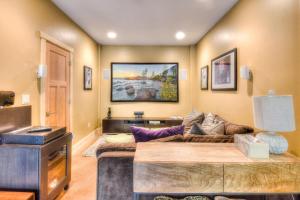 a living room with a couch and a tv at Shining Shire - Sauna steam shower very cool in South Lake Tahoe