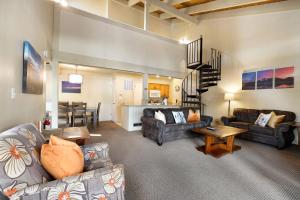 a living room with two couches and a dining room at Lakeland Sandy Beach Retreat - Private Escape in South Lake Tahoe