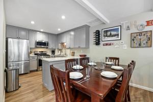 a kitchen and dining room with a table and chairs at Family Fun Getaway - 3 Story Condo in Zephyr Cove