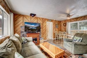 a living room with a couch and a fireplace at Whispering Pines Cabin - Family & Pet Friendly Abode in South Lake Tahoe