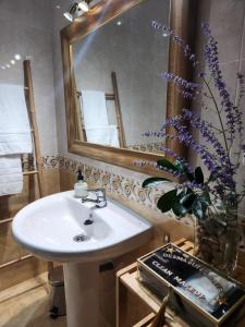 a bathroom with a sink and a mirror at Elduayen Luxury Centro in Vigo +29 photos