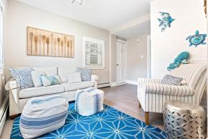 a living room with a couch and two chairs at New Short distance to Ocean in Wells