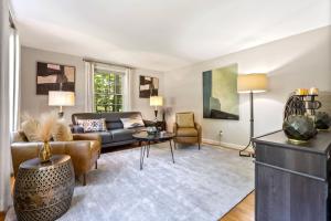 a living room with a couch and a table at Maine Adventure 3BR Oasis Awaits in York