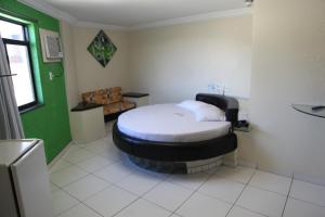 Postel nebo postele na pokoji v ubytování Hotel Pirâmide Rodoviária