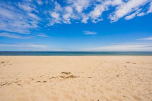 a sandy beach with the ocean in the background at Oceanfront Home Beach Access Deck & Ping Pong in Old Orchard Beach