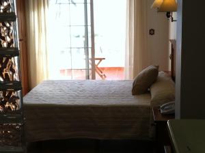 Posteľ alebo postele v izbe v ubytovaní Hotel Donde Caparrós