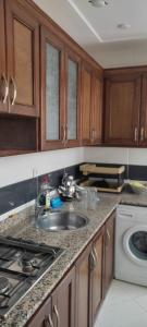 a kitchen counter with a sink and a stove at PISO En NADOR MARRUECOS in Nador