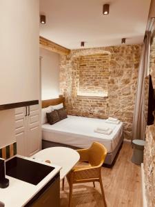 Postel nebo postele na pokoji v ubytování Corcyra Collection