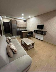 a living room with a couch and a table at bakuriani in Itʼkhvisi
